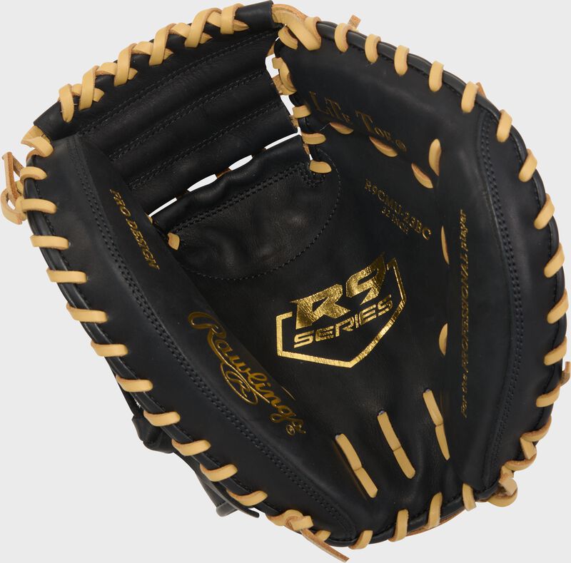 Black palm of a Rawlings R9 ContoUR 32-Inch Catcher's Mitt with gold stamping and camel laces