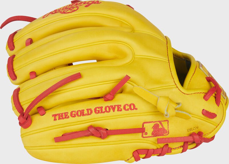 Back of a yellow Heart of the Hide ContoUR Fit 11.5-Inch Infield Glove with the MLB logo on the pinky
