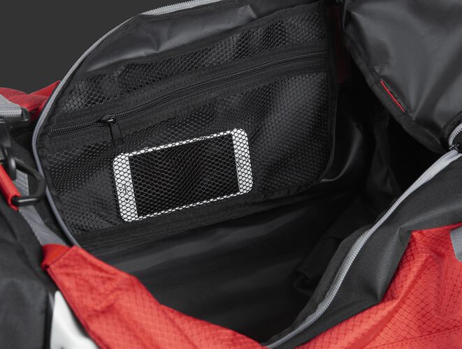 A phone inside the mesh accessory pocket inside the main compartment of a scarlet R601 Hybrid bag