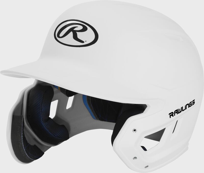 Left angle view of a MACHEXTL Rawlings Mach EXT Junior helmet with a one-tone matte white shell