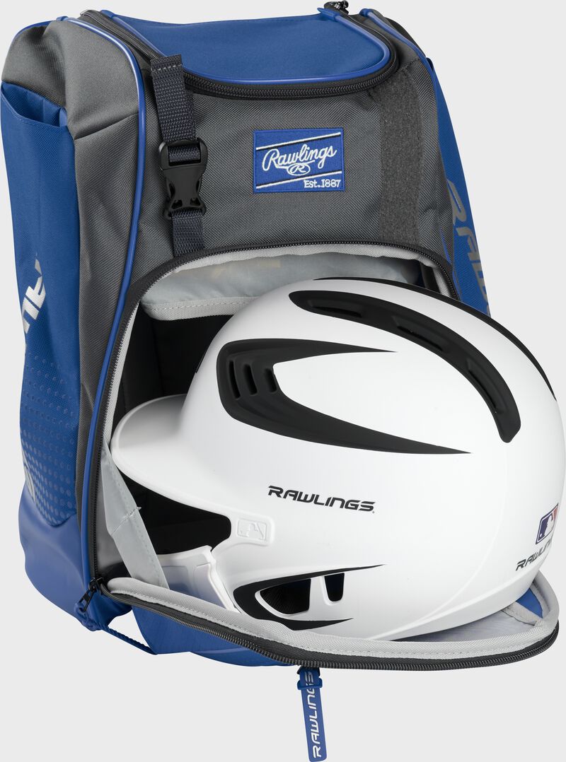 A white/black helmet in the main compartment of a royal Rawlings Franchise backpack - SKU: FRANBP-R