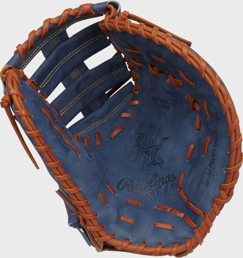 Palm of a Rawlings Heart of the Hide Pro Label Denim 1st base mitt with tan laces
