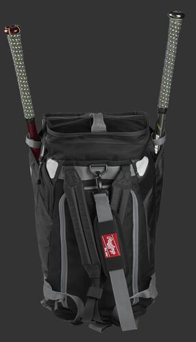 A black R601 Rawlings Hybrid duffel/backpack standing up with two bats