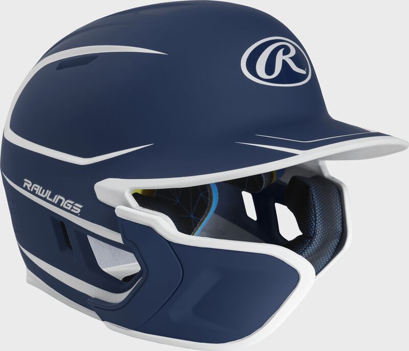Right angle view of a matte navy/white MACHEXTR Mach Junior helmet with Mach EXT left hand batter face guard extension
