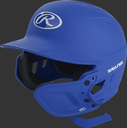 A matte royal MEXT attached to a Mach batting helmet showing the hardware