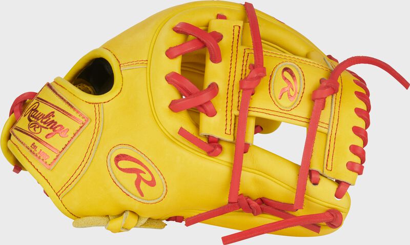 Thumb of a yellow Heart of the Hide ContoUR Fit 11.5-Inch Infield Glove with a pro I-web