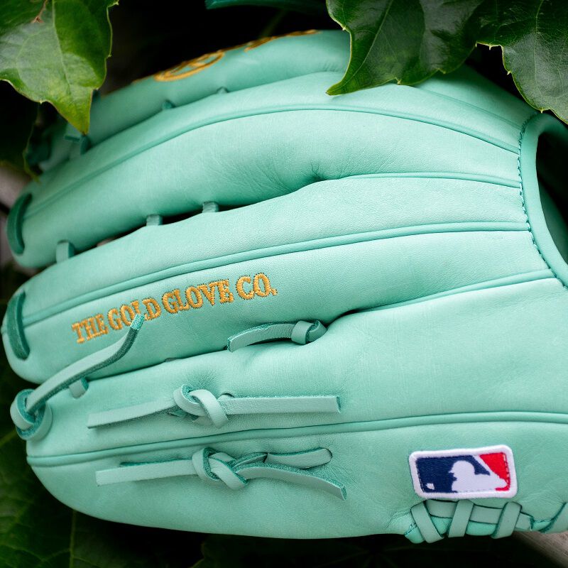 Picture of the back of an ocean mint Gameday 57 Harrison Bader glove with the MLB logo loading=