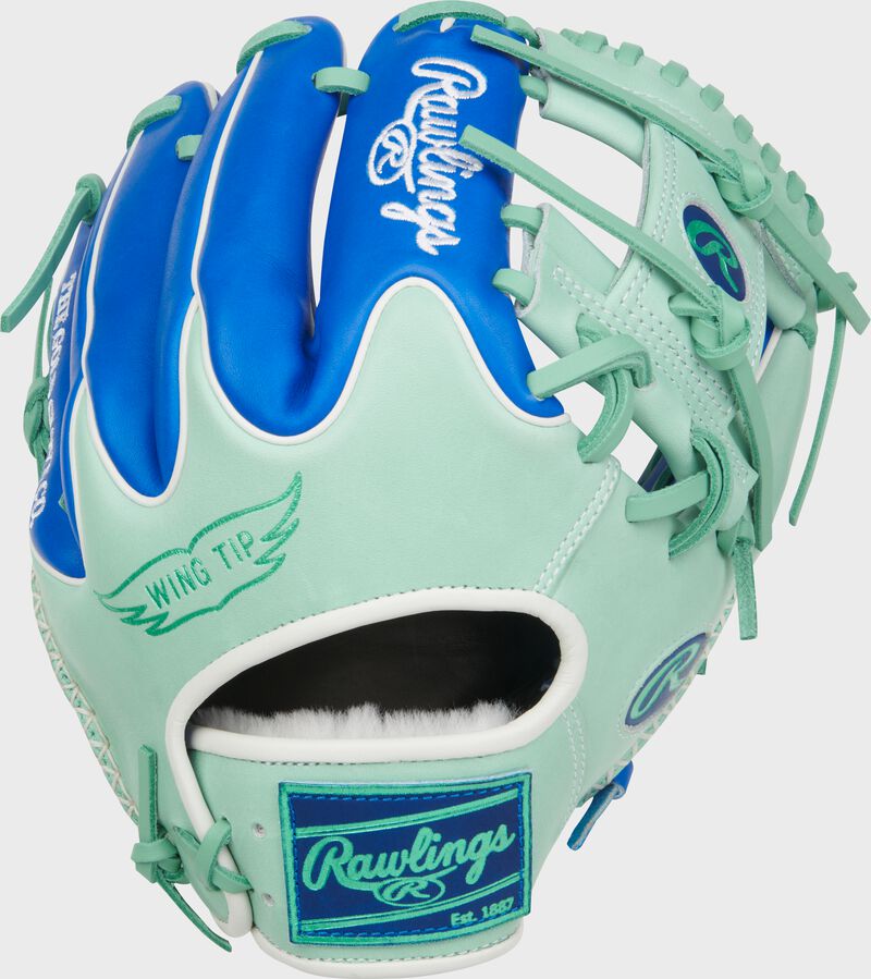 Royal/mint Wing tip back of a Rawlings Pro Preferred 11.5-Inch Wing Tip Infield Glove with a royal Rawlings patch