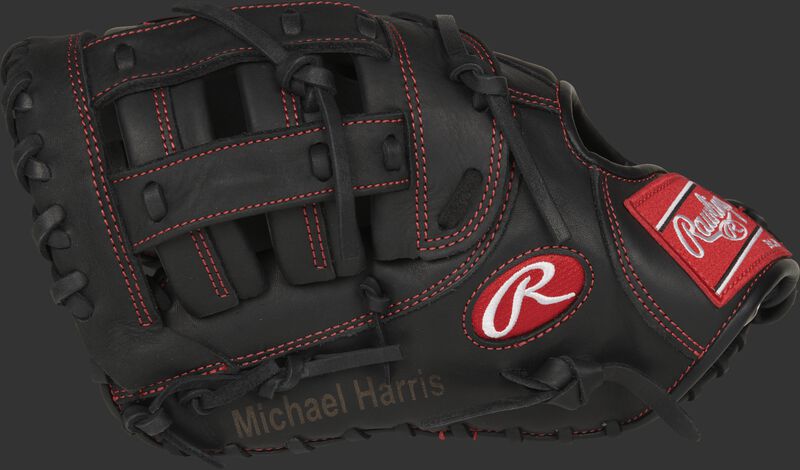 Thumb view of a blemished black 12-inch Gamer 1st Base mitt with Michael Harris engraved on the thumb