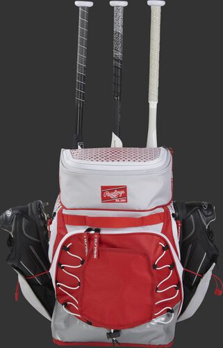 A white/scarlet R800 fastpitch backpack with shoes in the external shoe storage and 3 bats in the bat compartment