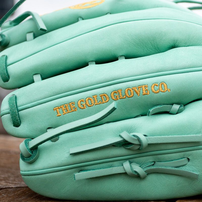 Picture of "The Gold Glove Co." embroidered on the finger of a Gameday 57 Series Harrison Bader Glove loading=