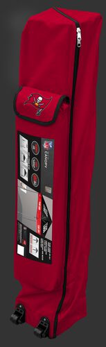 Red wheeled carry case of a Tampa Bay Buccaneers canopy with the team logo on the outside compartment - SKU: 02231086111