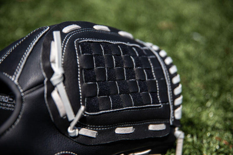 Black Basket web on a Rawlings Softball Series softball glove with a field in the background - SKU: RSB125GB
