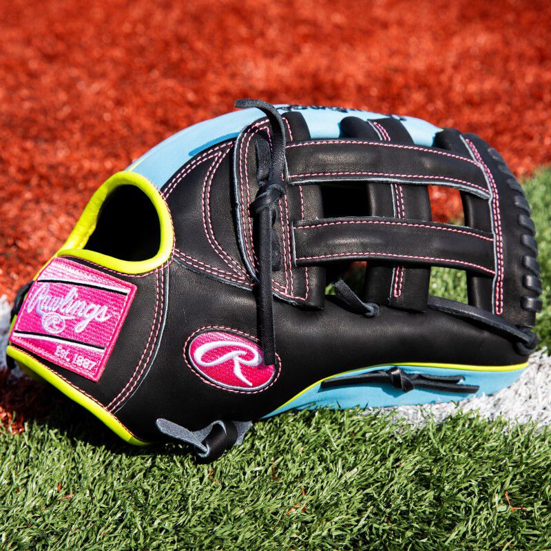 Thumb of a ColorSync 8.0 Heart of the Hide glove on a field 