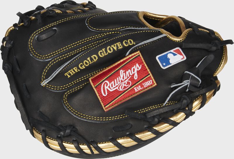 Black back of a Heart of the Hide 33.5-Inch catcher's mitt with a red Rawlings patch - SKU: PROG24