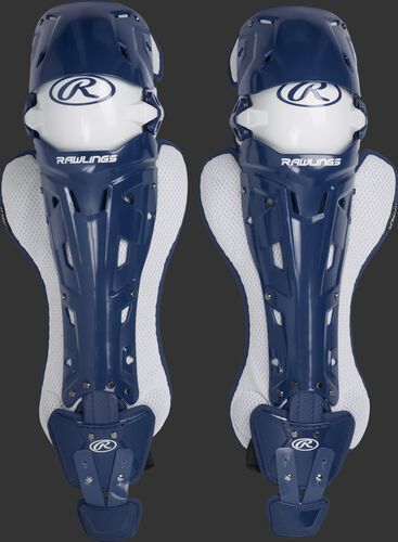 A pair of navy Rawlings Mach catcher's leg guards with white accents - SKU: MCHLGI-N