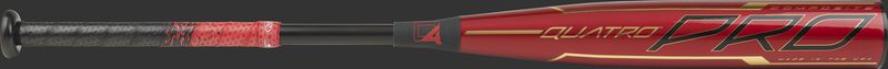 Barrel of a red BBZQ3 2020 Quatro Pro BBCOR bat with black and gold accents