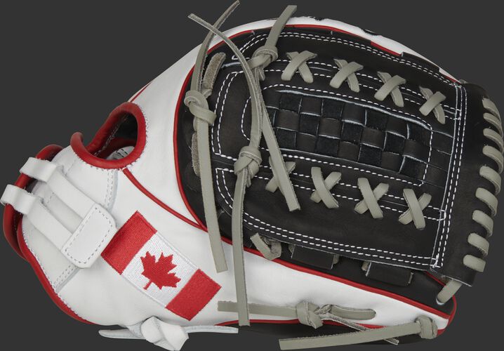 A white PRO716SB-18CAN 12-Inch HOH Canada softball glove with a black double-laced Basket web and Canadian flag on the thumb