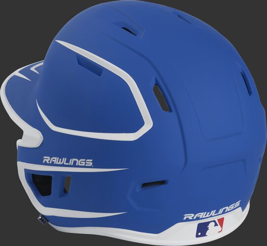 Back left view of a matte royal/white MACHEXTR MACH series two-tone batting helmet with air vents