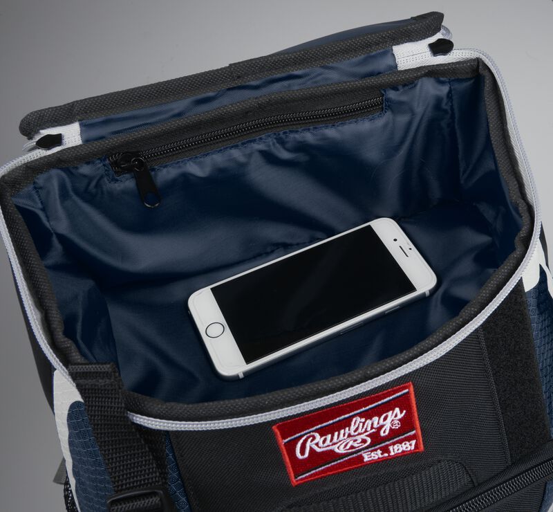 Top accessory pocket of a black/navy R500 equipment backpack holding a phone