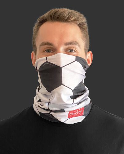 A guy wearing a soccer design adult neck gaiter over his mouth and nose - SKU: RC40006-100