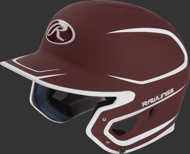 Left angle view of a Rawlings MACH Senior helmet with a two-tone matte cardinal/white shell