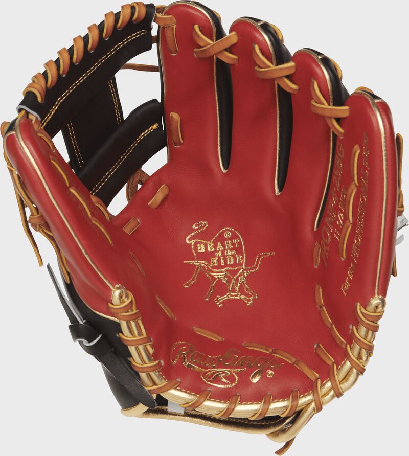 Palm view of a Rawlings PRONP4-2SBG Heart of the Hide infield glove with a scarlet palm and tan laces