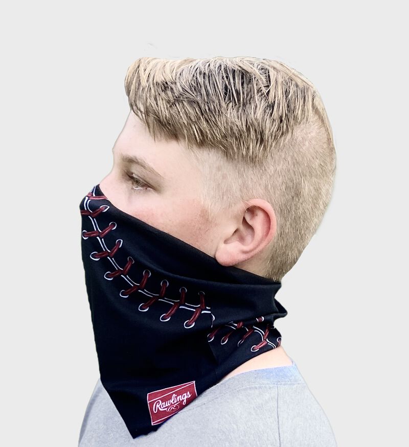 A kid wearing a black baseball stitch neck gaiter with it covering his mouth and nose - SKU: YRC40001-001