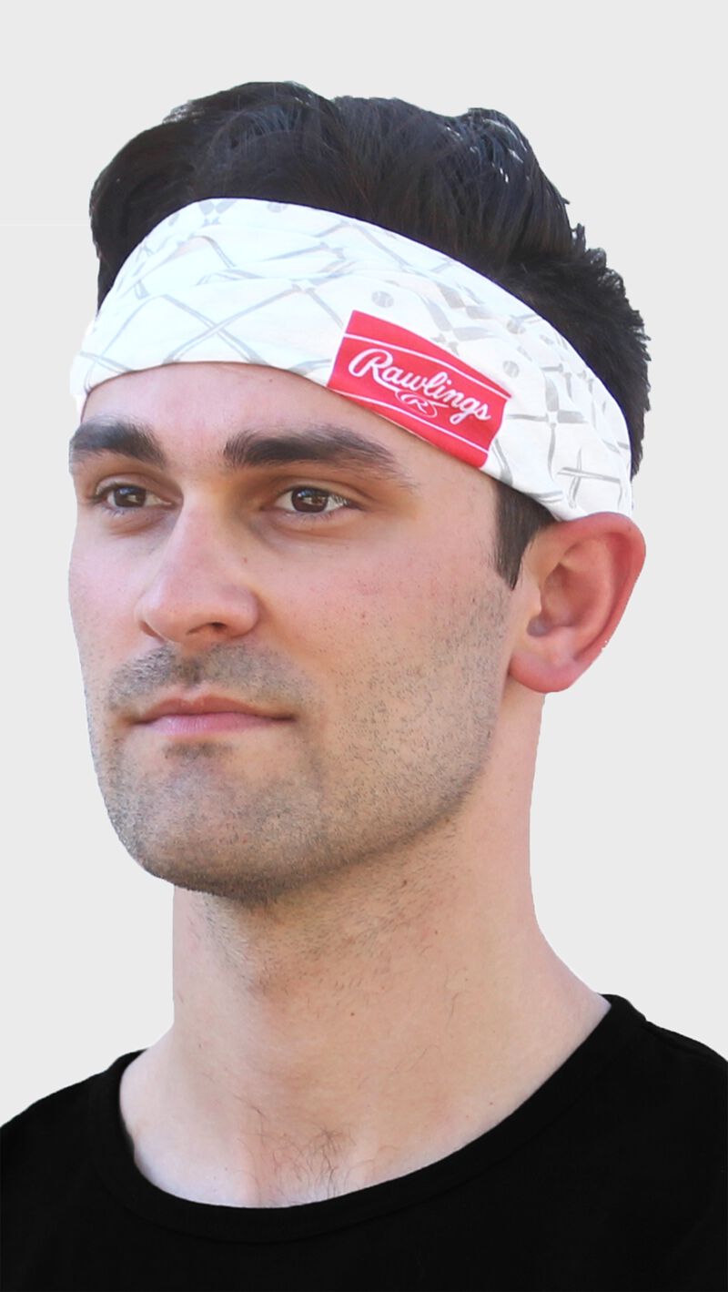 A guy wearing a white Rawlings multi-purpose neck gaiter as a head band - SKU: RC40005-100 loading=