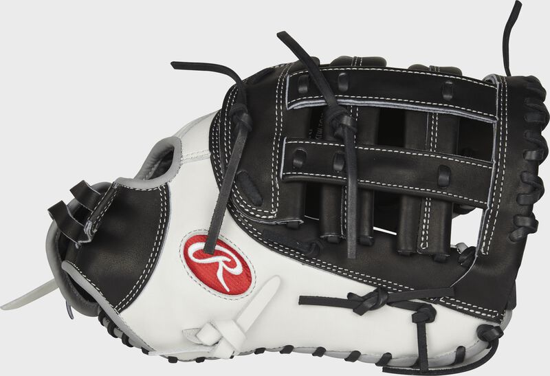 Thumb view of a PROFM19SB-17BW Heart of the Hide 13-inch softball first base mitt with a white thumb and black Modified H web