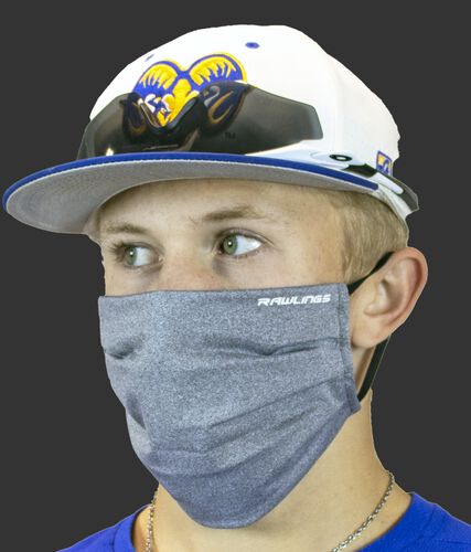 Angle view of a player wearing a heather gray Rawlings sports mask - SKU: RMSKE-HGRY