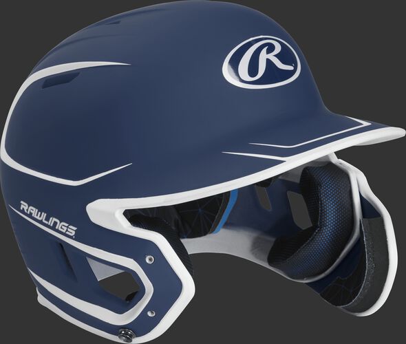Right angle view of a MACHEXTR Rawlings Mach EXT junior helmet with a two-tone matte navy/white shell