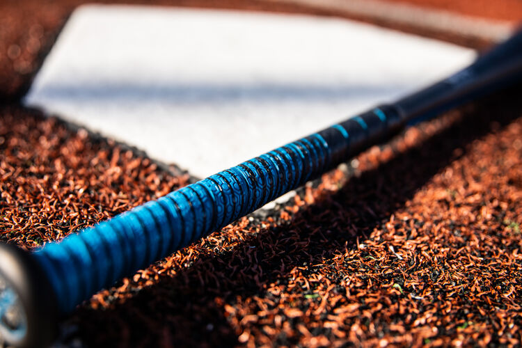 Blue grip on a USA -5 5150 baseball bat next to home plate - SKU: US155