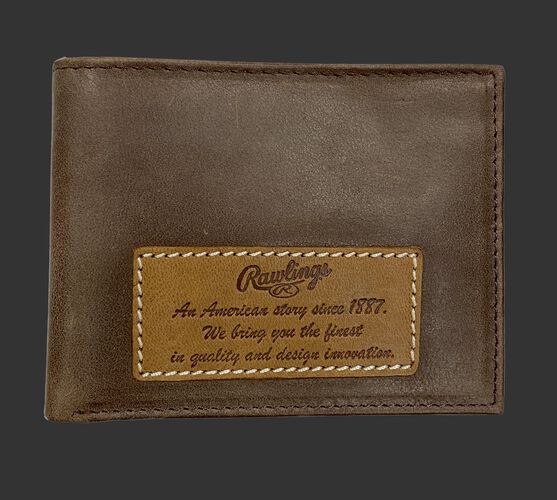 A brown American Story bi-fold wallet with a leather patch on it telling the Rawlings American story - SKU: RPW001-200