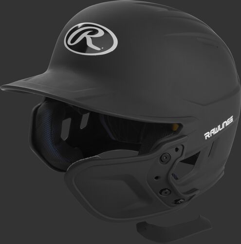 A matte black MEXT attached to a Mach batting helmet showing the hardware