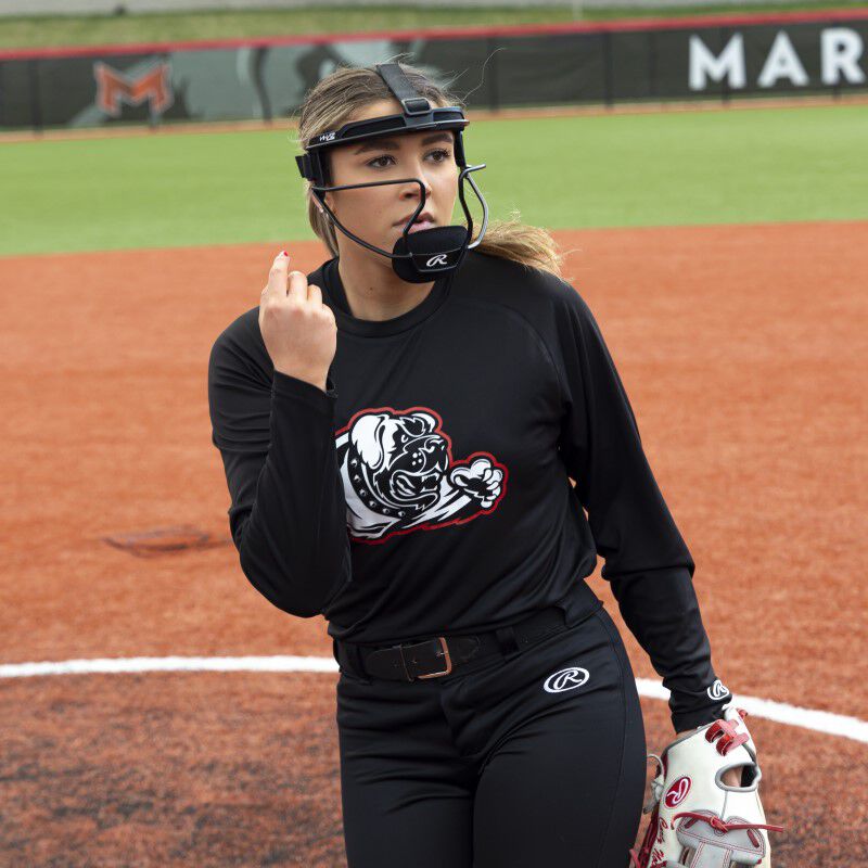 A pitcher finishing a pitch wearing a black Rawlings Hi-Viz fielder's mask - SKU: RSBFMV