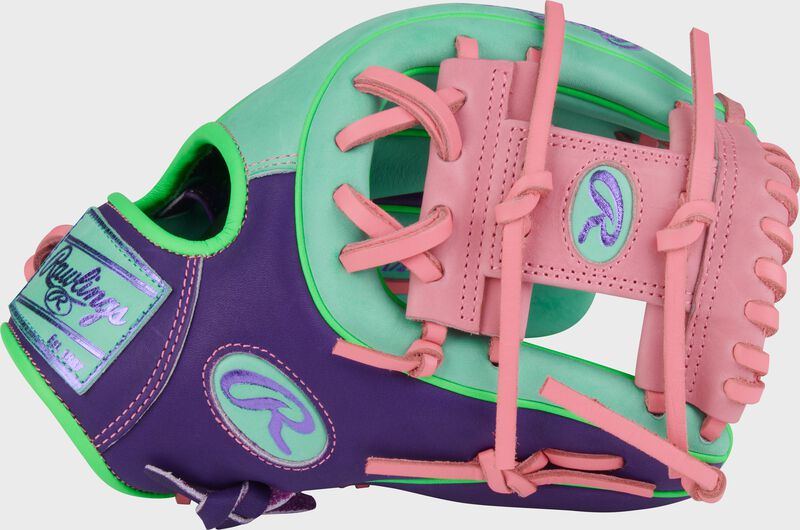 Purple thumb of a Heart of the Hide ContoUR Fit 11.5-Inch Infield Glove with a pink Pro I-web