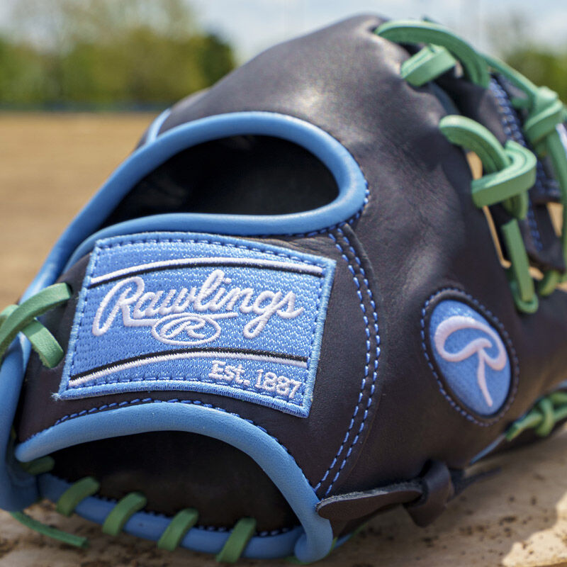 Picture of the Columbia blue Rawlings patch on a navy exclusive Rawlings NXT Series 11.5" infield glove