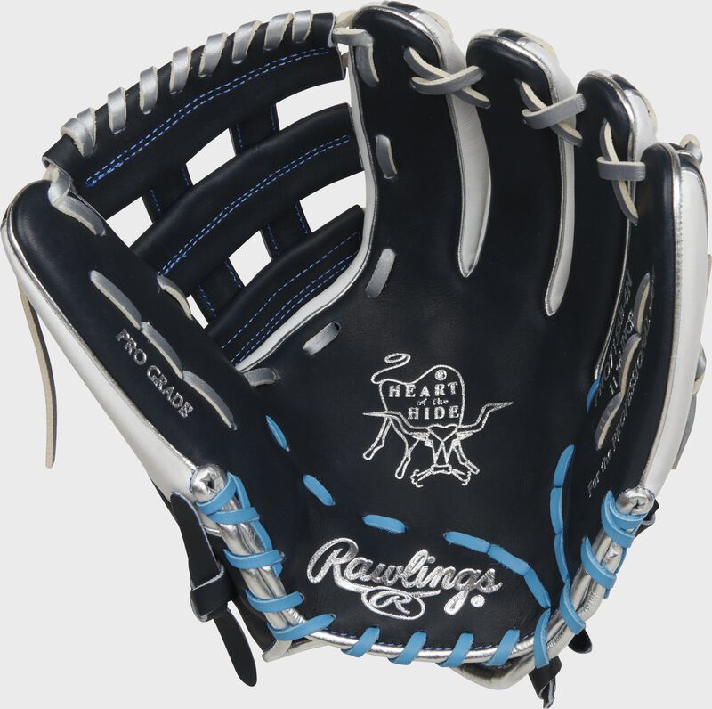 Navy palm of a Rawlings Heart of the Hide fastpitch softball glove with silver stamping and white/Columbia blue laces - SKU: PRO715SB-6N