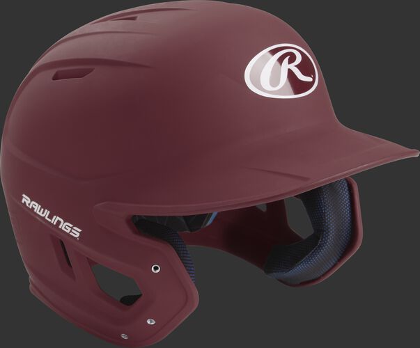 Right angle view of a matte MACH batting helmet with a maroon shell