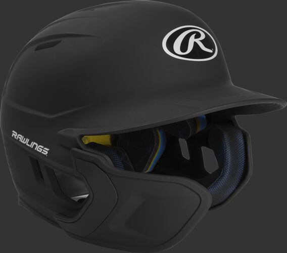 Right angle view of a matte black MACHEXTL Mach Junior helmet with Mach EXT left hand batter face guard extension