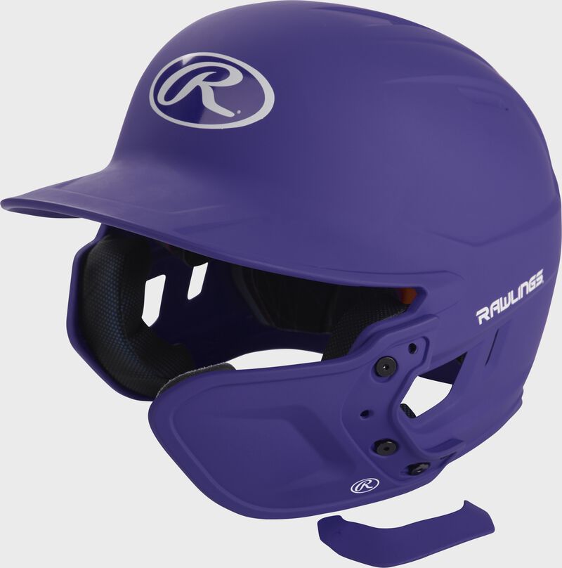 A matte purple MEXT attached to a Mach batting helmet showing the hardware loading=