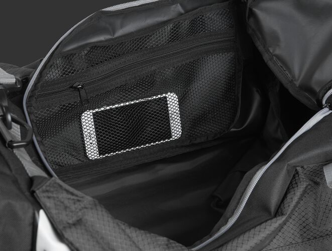 A phone inside the mesh accessory pocket inside the main compartment of a black R601 Hybrid bag