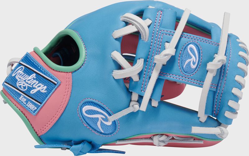 Columbia blue thumb of an Exclusive Rawlings NXT Series 11.5" Infield Glove with a columbia blue I-web