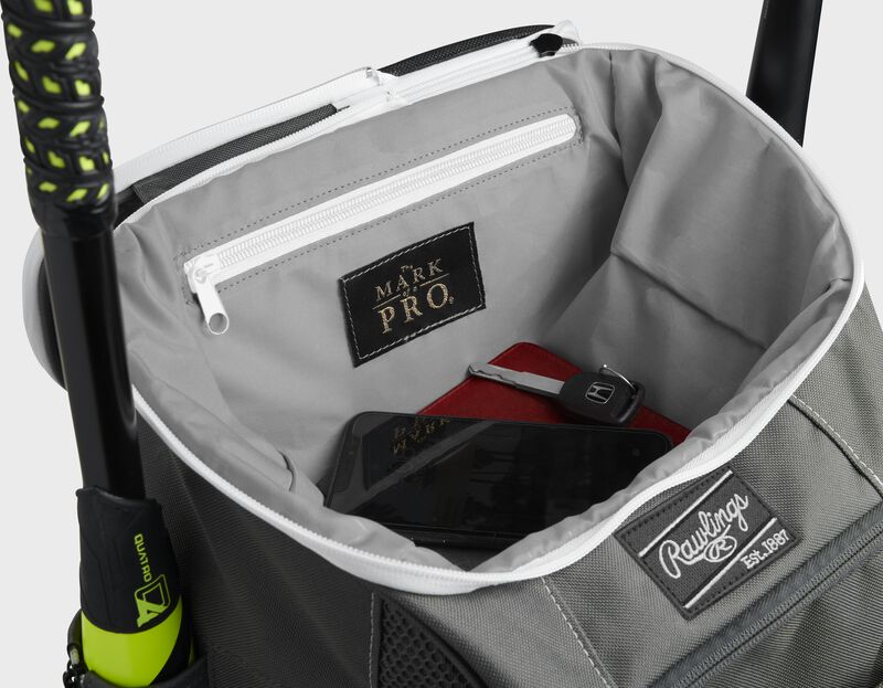 Top compartment of a graphite Impulse bag with a phone, keys and black "The Mark of a Pro" patch - SKU: IMPLSE-GR