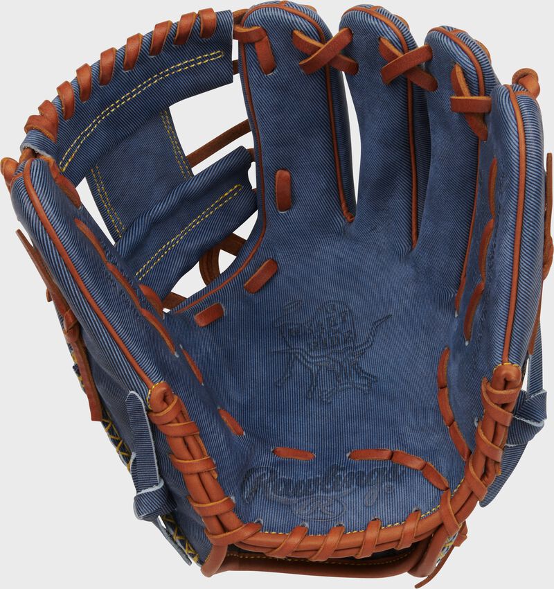 Palm of a Rawlings Heart of the Hide Pro Label Denim infield glove with tan laces