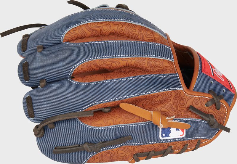 Denim/tan printed leather back of a 2024 All-Star Game HOH glove with the MLB logo on the pinky