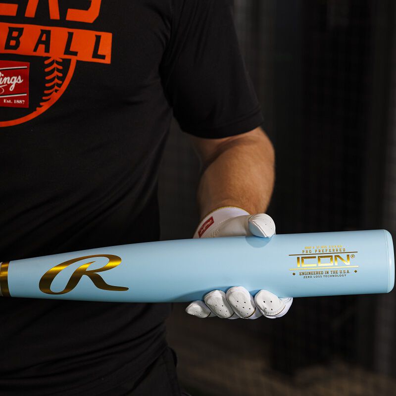 A player holding a Rawlings Icon Pro Preferred BBCOR baseball bat showing the barrel