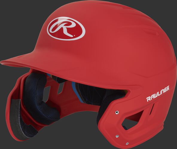 Left angle view of a MACHEXTL Rawlings Mach EXT Senior helmet with a one-tone matte scarlet shell
