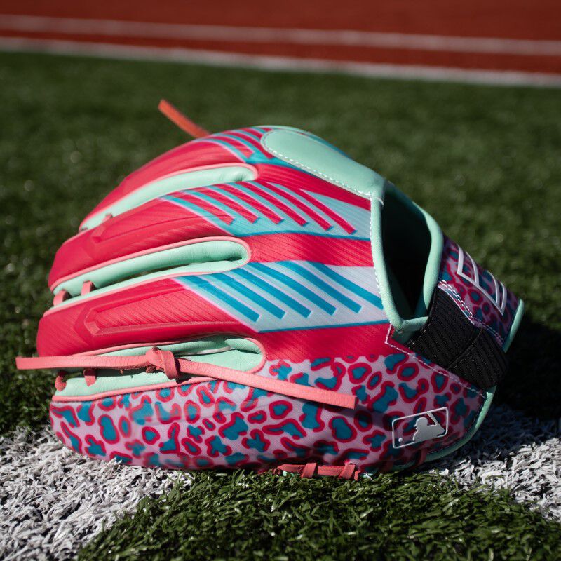 Back pinky of a REV1X ColorSync 8.0 glove on a field loading=